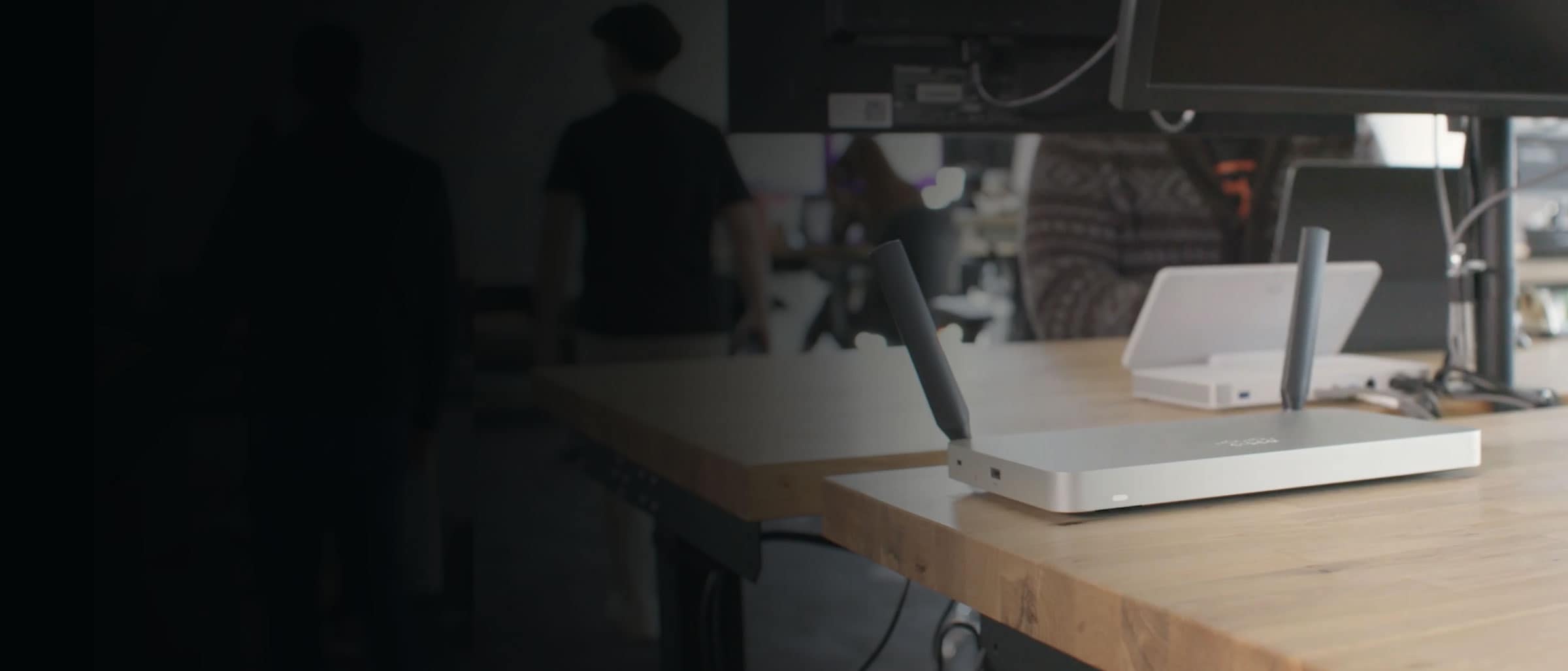 Cisco Meraki MX router on a desk in an open work area