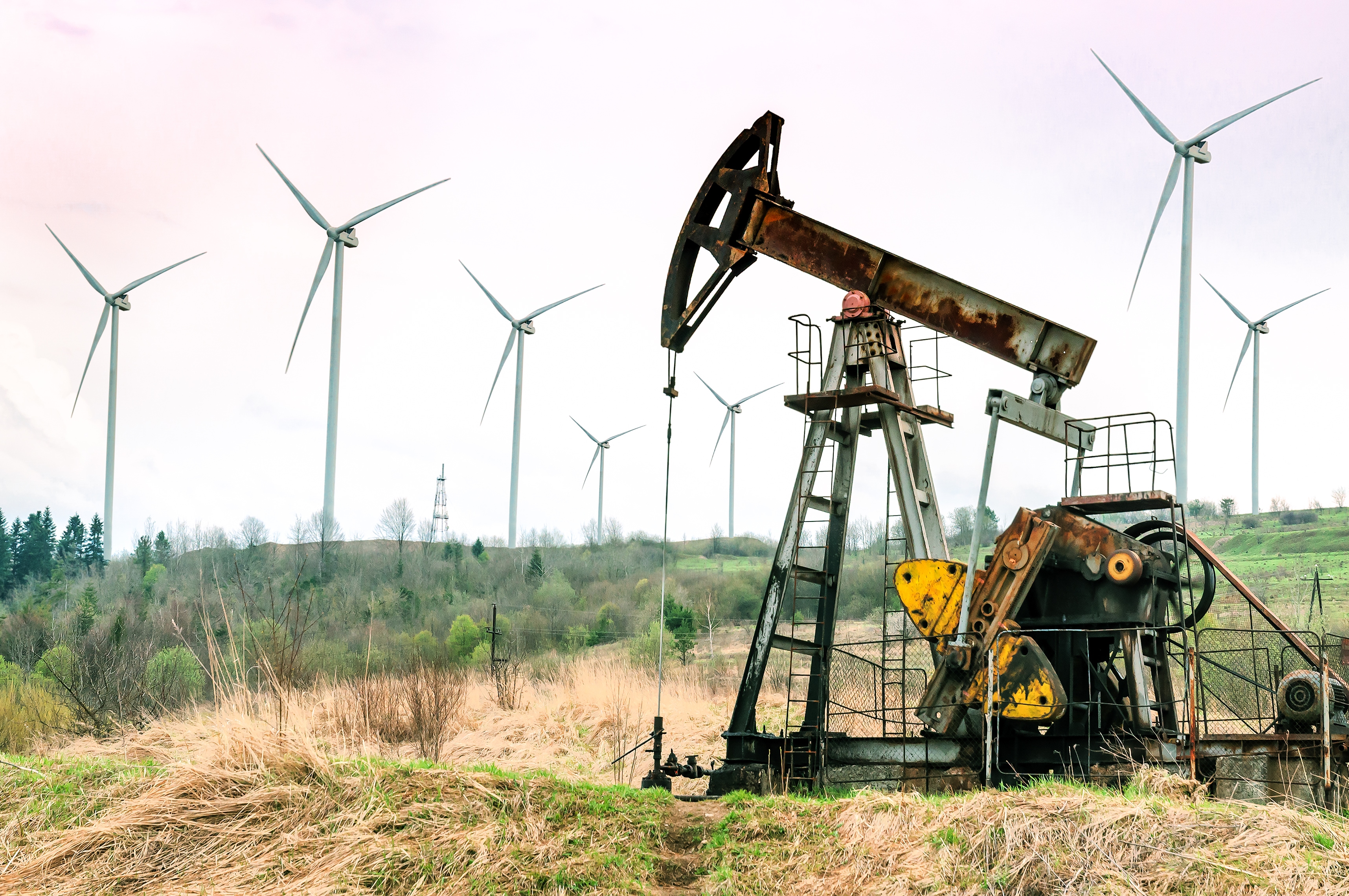 Oil drill in middle of field.